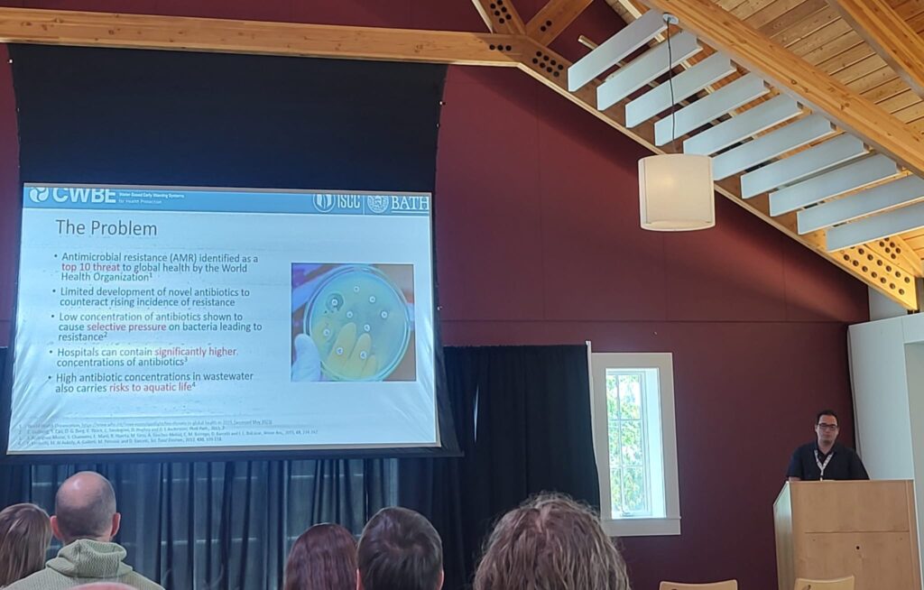 Dr. Neil Andrew Byrnes presenting his research titled "Assessing the risk of antimicrobial resistance and potential environmental harm through national-scale surveillance of antimicrobials in hospital and community wastewater" at the Testing the Waters 8 conference.